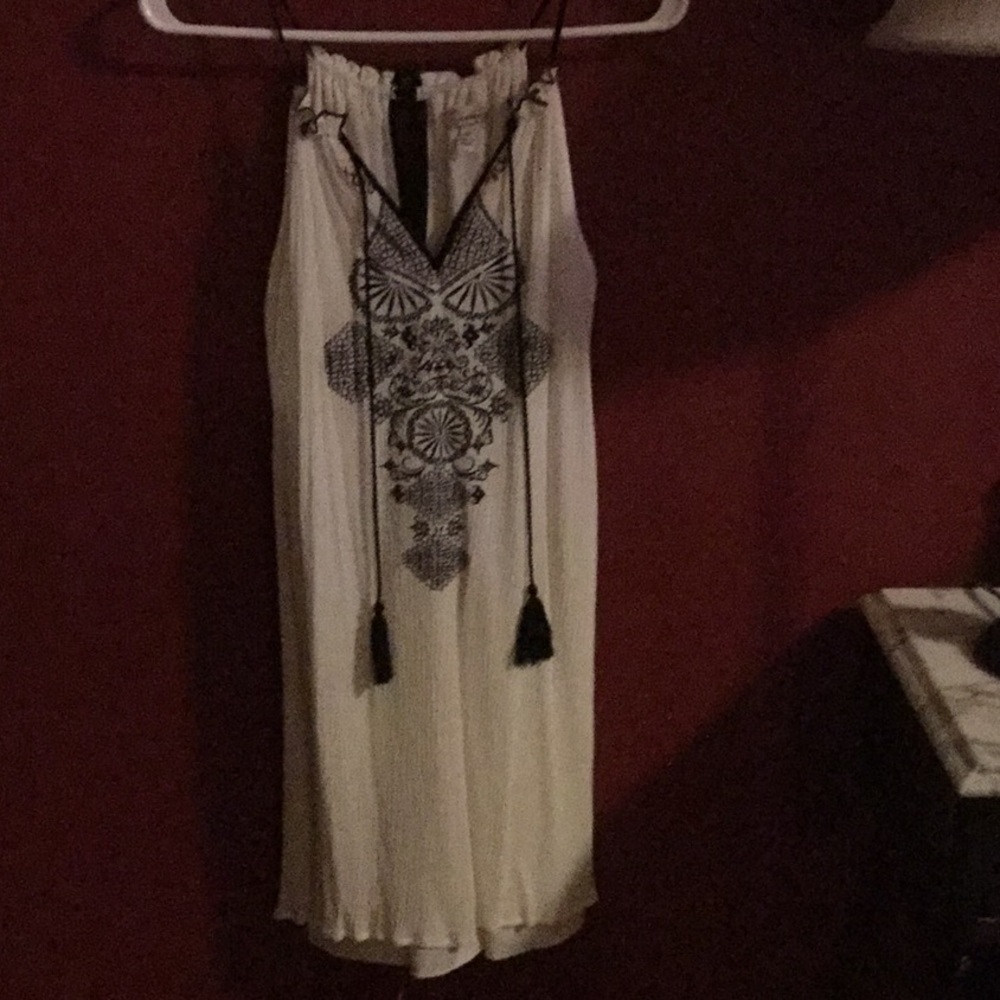 white mini dress with black embellishment